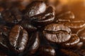 Closeup background of roasted arabica coffee beans with aroma smoke