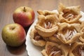 Closeup of baked biscuits covered with icing sugar and cinnamon