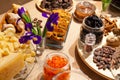 Closeup bakery and snacks, dried fruits, pieces parmesan cheese, flowers, nuts, cinnamon sticks, raisin biscotti. Concept Royalty Free Stock Photo