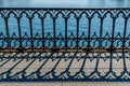 Closeup of the balustrade of the MÃÂ¼nsterbrÃÂ¼cke Switzerland forming an interesting design with its shadow on the ground Royalty Free Stock Photo