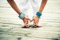 Closeup of barefoot woman feet and hands practice yoga outdoor Royalty Free Stock Photo