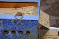 Closeup of a barrel organ with folded cardboard book