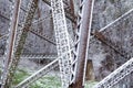 Closeup of the base of the Cap-Rouge 1908 railway trestle bridge covered in a light unseasonal spring snow fall Royalty Free Stock Photo