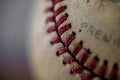 closeup of baseball seams or stitching on worn baseball with heavy bokeh around Royalty Free Stock Photo