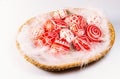 Closeup basket with Easter red eggs with folk white pattern lay on feather on white background. Ukrainian traditional eggs