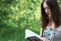 Closeup bbeautiful girl walking reading book Royalty Free Stock Photo