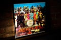 Closeup of The Beatles Sgt. Pepper\'s Lonely Hearts Club Band Vinyl Record Cover Leaning Against Brick Wall