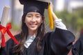 Closeup beautiful asian graduated student girl holding diploma