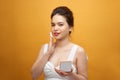 Closeup Of Beautiful Asian Woman With Cushion Puff And Mirror Applying Makeup Powder Foundation Royalty Free Stock Photo