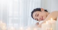 Closeup beautiful asian young  woman lying down on massage beds at Asian luxury spa and wellness center. Royalty Free Stock Photo