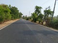 Closeup beautiful asphalt road or path in a forest of the Ghati Subramanya Temple, Near Doddaballapura Royalty Free Stock Photo