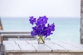 Closeup beautiful bouquet of blue orchids flower on a white wooden table near sea. Thailand Royalty Free Stock Photo