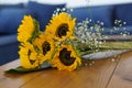 Closeup of a beautiful bouquet of sunflowers on a wooden table. Royalty Free Stock Photo