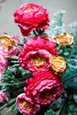 Closeup beautiful exquisite bouquet made from large artificial red peonies