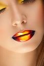 Closeup beautiful female face with colored glossy lips