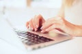 Closeup beautiful female hands typing on keyboard using a laptop in a cafe ,successful business woman,working,,blurred background Royalty Free Stock Photo