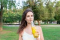 Closeup of beautiful girl with a bottle of fresh juice. Healthy woman is posing with lemonade. Diet nutrition with detox juice Royalty Free Stock Photo