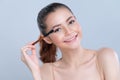 Closeup beautiful girl with flawless applying glamorous eye shadow makeup. Royalty Free Stock Photo