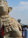 Closeup of beautiful huge or big Lord Shiva Vehicle Nandi, Basava in a blue sky background