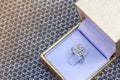 Closeup Beautiful and luxury wedding diamond ring in gold box on silver background Royalty Free Stock Photo