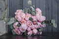 Closeup of beautiful pink rose bouquet held by a gracious bride