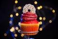 Closeup, beautiful red cupcake with sprinkles