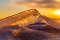 Beautiful spring melting ice at frozen lake again sunset