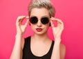 Closeup beautiful trendy hipster girl in retro sunglasses Royalty Free Stock Photo