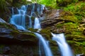 Beautiful waterfall rushing in mountain canyon Royalty Free Stock Photo
