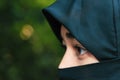 Closeup of beautiful woman face covered with hijab. Perfect shiny eyes of a Muslim girl. Young niqab girl portrait. Royalty Free Stock Photo