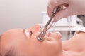 Woman while procedure jet peeling, facial treatmen Royalty Free Stock Photo