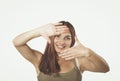 Closeup of beautiful woman making frame with her hands Royalty Free Stock Photo