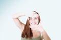 Closeup of beautiful woman making frame with her hands Royalty Free Stock Photo