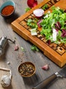 Closeup of a beautiful wooden cutting board with a knife on a wooden background Royalty Free Stock Photo