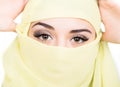 Closeup of beautiful young arabian woman in yellow hijab. Charm and beauty of the East. Royalty Free Stock Photo