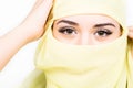 Closeup of beautiful young arabian woman in yellow hijab. Charm and beauty of the East. Royalty Free Stock Photo