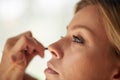 Closeup Of Beautiful Young Woman Face With Beauty Makeup, Fresh Soft Skin And Long Black Thick Eyelashes Applying Royalty Free Stock Photo