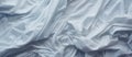 A closeup of electric blue satin sheets stacked on a bed Royalty Free Stock Photo