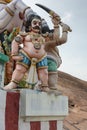 Closeup of belligerent Karuppana Sami deity.