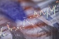 Closeup Benjamin Franklin face on USD banknote with stock market chart graph and American flag for currency exchange and global Royalty Free Stock Photo