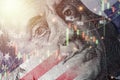 Closeup Benjamin Franklin face on USD banknote with stock market chart graph and United States flag for currency exchange and Royalty Free Stock Photo