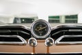 Closeup of Bentley Bentayga Analog dashboard clock chrome and wooden finish