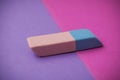 bicolor eraser on pink and purple background Royalty Free Stock Photo