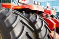 Closeup of big black rubber wheels of an agricultural tractor Royalty Free Stock Photo