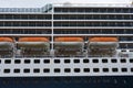 Closeup of a big cruise liner and its rescue boats. Royalty Free Stock Photo