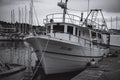 Closeup of a big fisher boat in greyscale standing in Croatia harbor