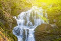 Big waterfall rushing from mount wall