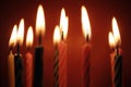 Closeup of birthday candles all lit. Royalty Free Stock Photo