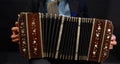 a closeup of a black bandoneon in the process of playing Royalty Free Stock Photo
