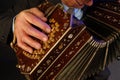 a closeup of a black bandoneon in the process of playing Royalty Free Stock Photo